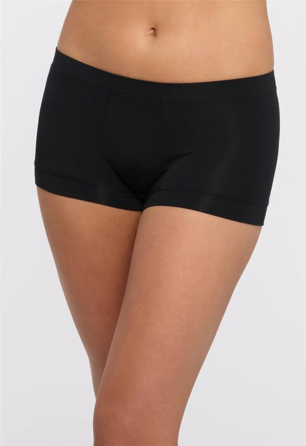 Black boxer-style underwear worn by a person on a white background