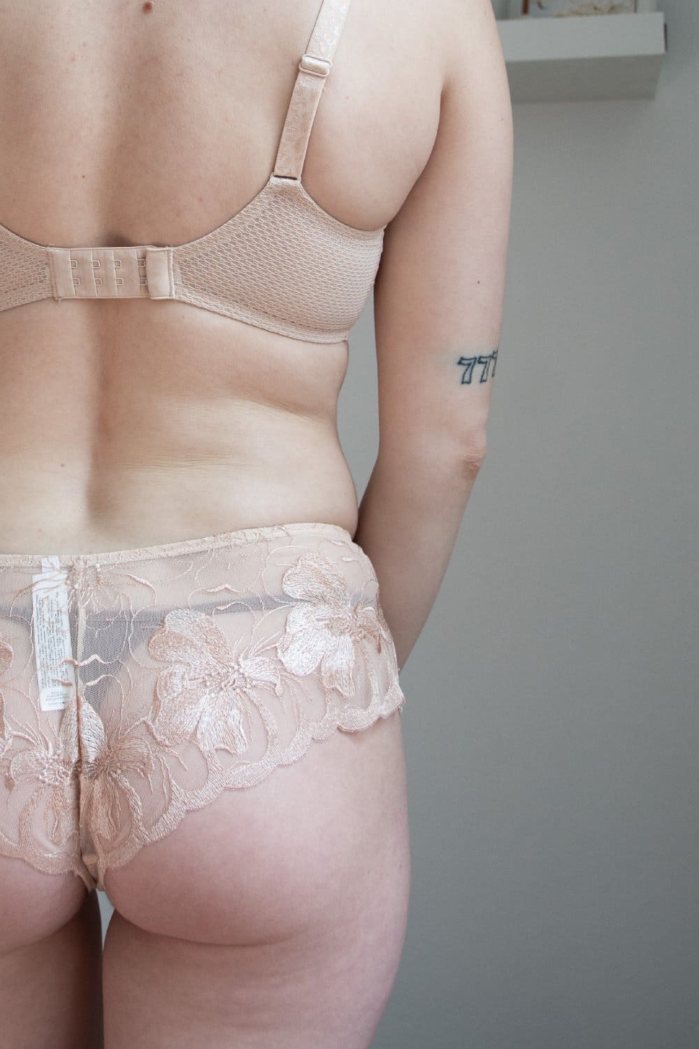 Chantelle Fleurs Demi Bra in sugar, back view on a model, close-up.