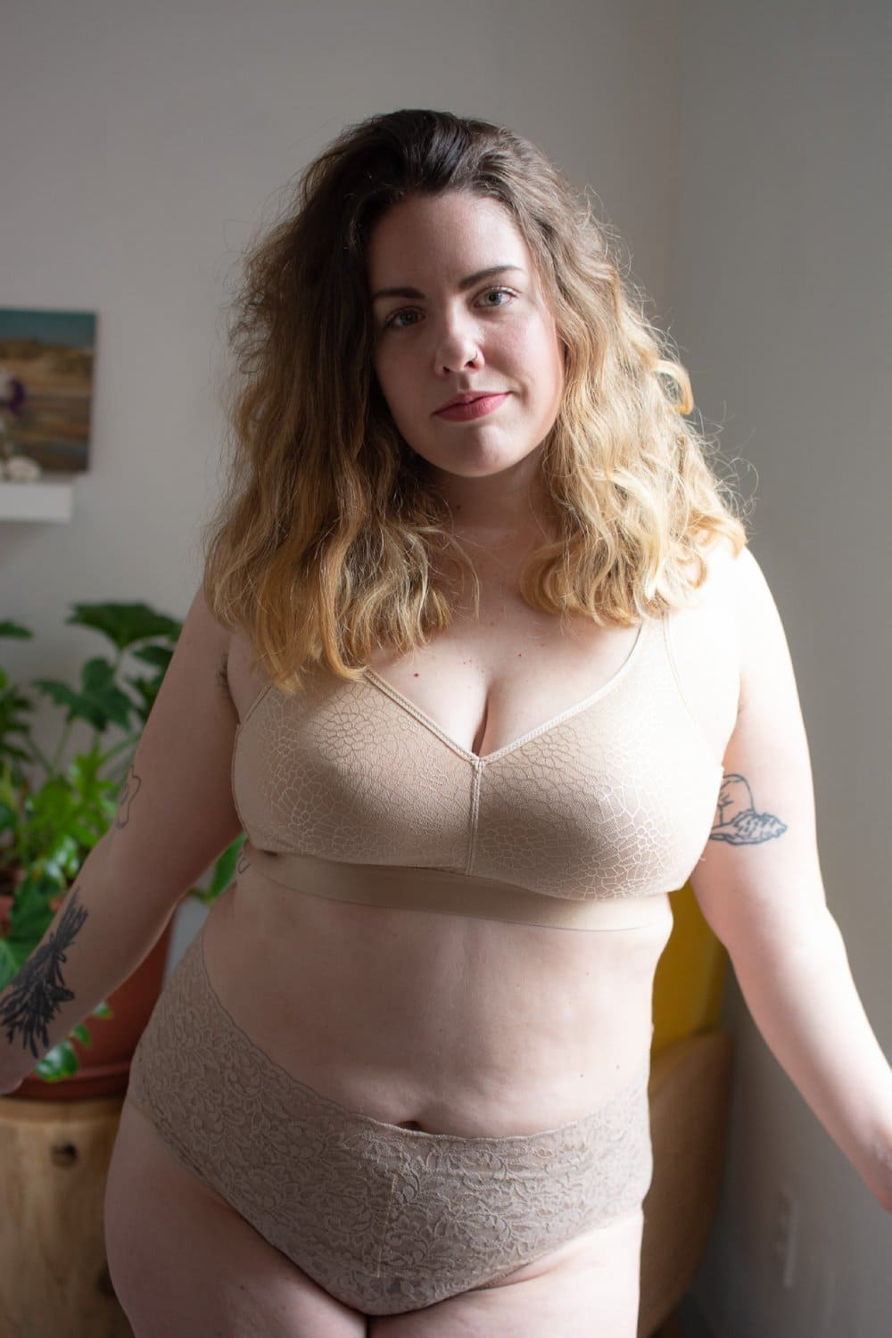 Chantelle C-Magnifique full bust wirefree bra in nude sand, front view on a model, close-up.