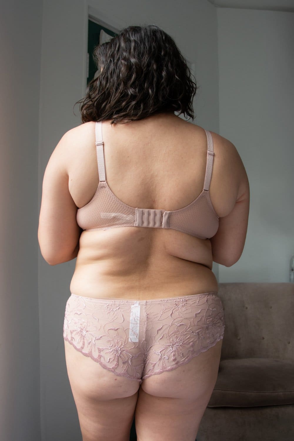 Chantelle Fleurs hipster in authentic pink, back view on a model, distant.