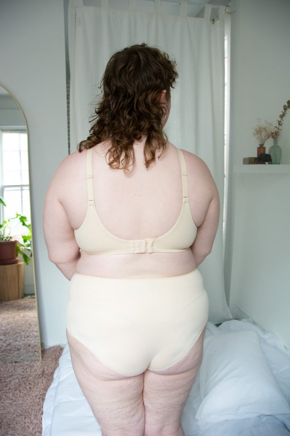 Chantelle norah high waist brief in nude blush, back view on a model, full-body, distance shot.