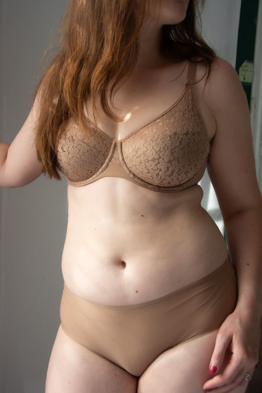 Chantelle soft stretch hipster in coffee latte, front view on a model, close-up.