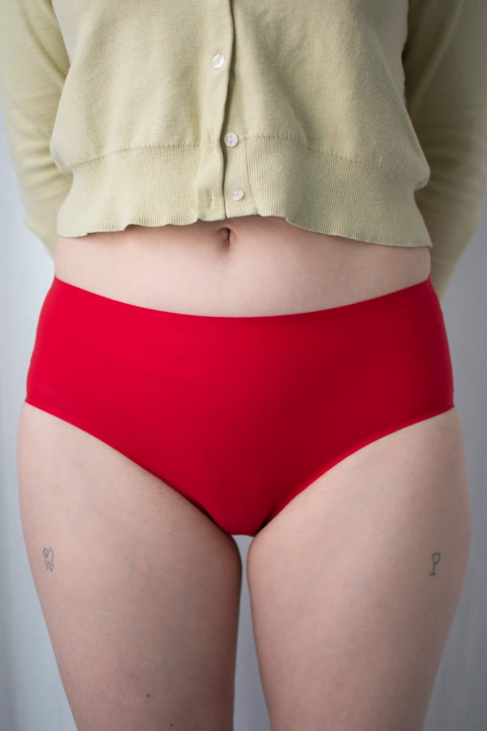 Chantelle soft stretch hipster in poppy red, front close-up on a model.
