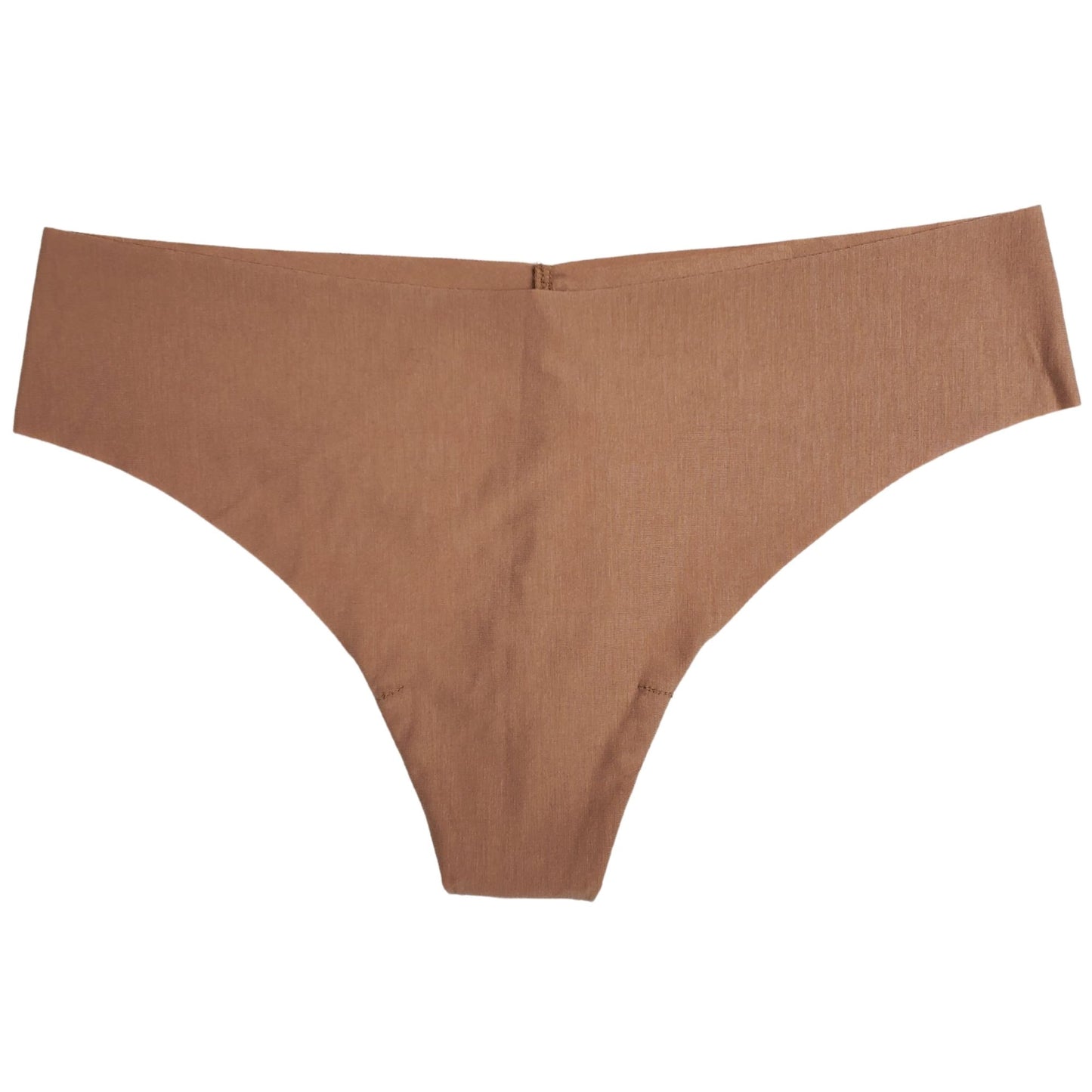 A beige Commando brand seamless thong underwear laid flat on a surface.