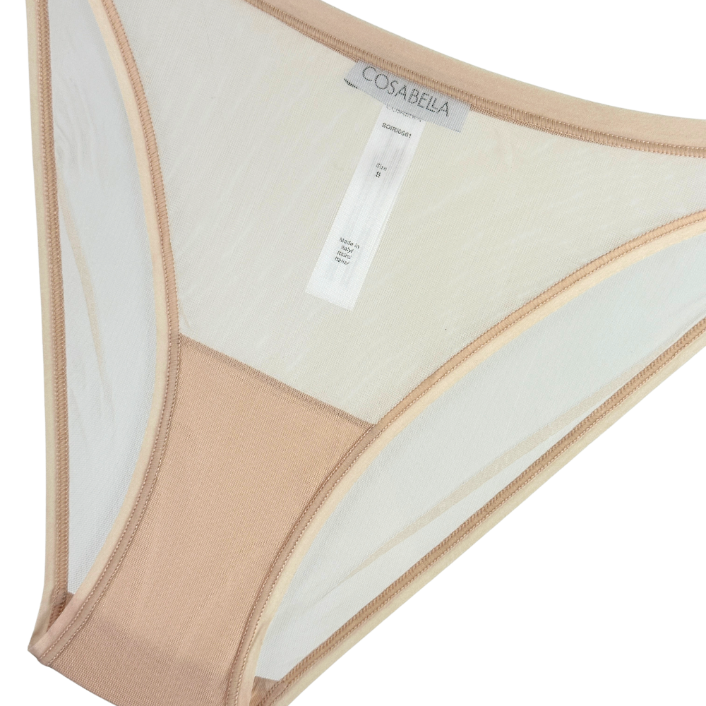 Beige underwear with a visible brand label on a white background