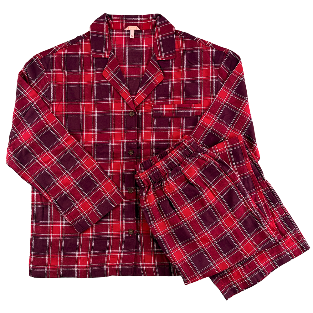 plaid red pajamas with long pants and a button up shirt against a white background.