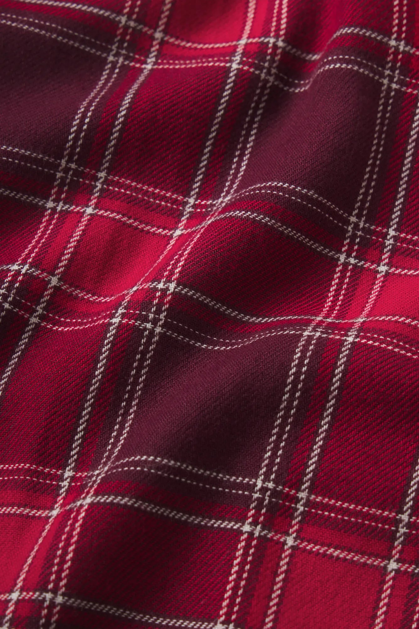 Close up of berry red flannel fabric.