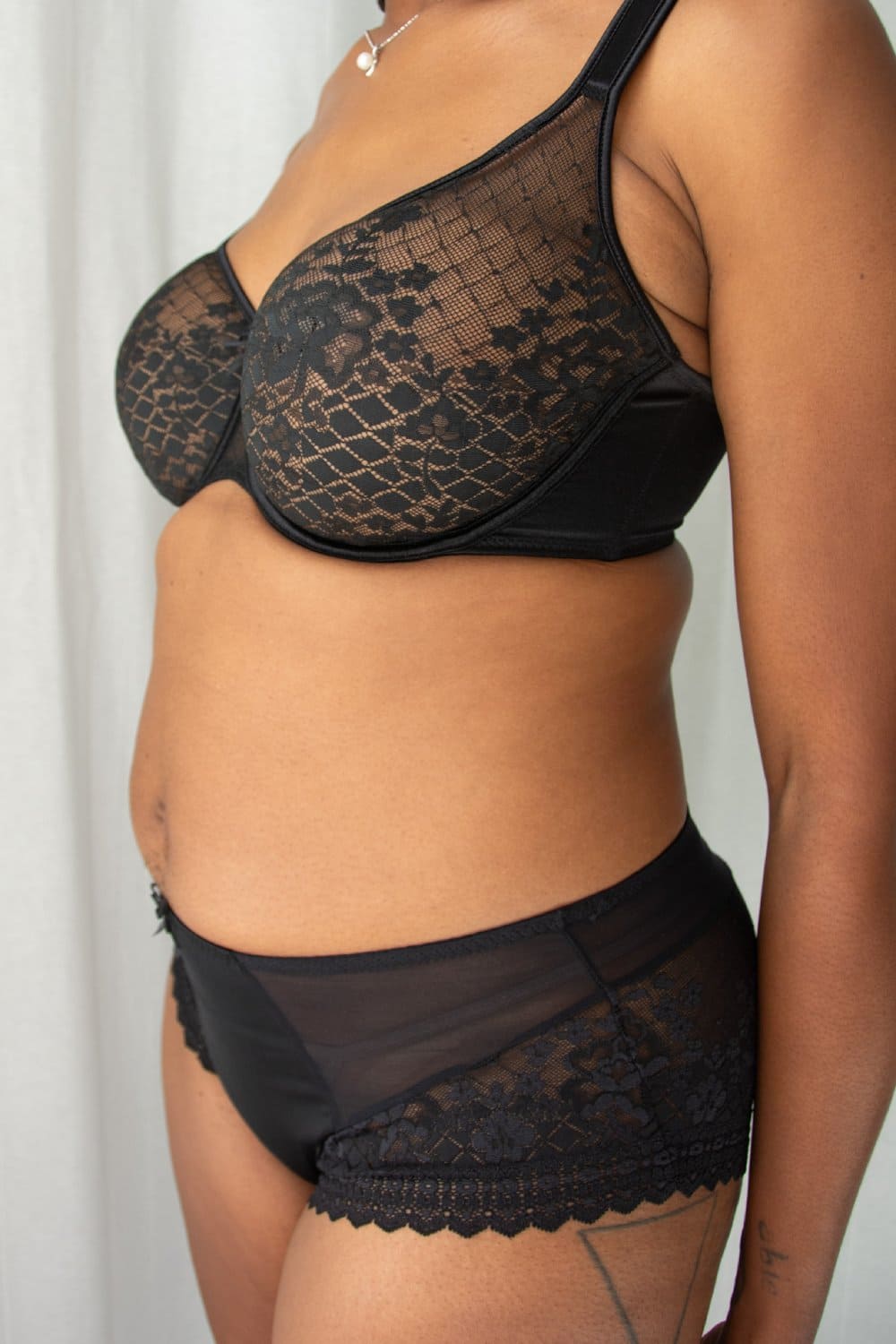 Empreinte melody underwire seamless bra in black, a model side view, close-up.