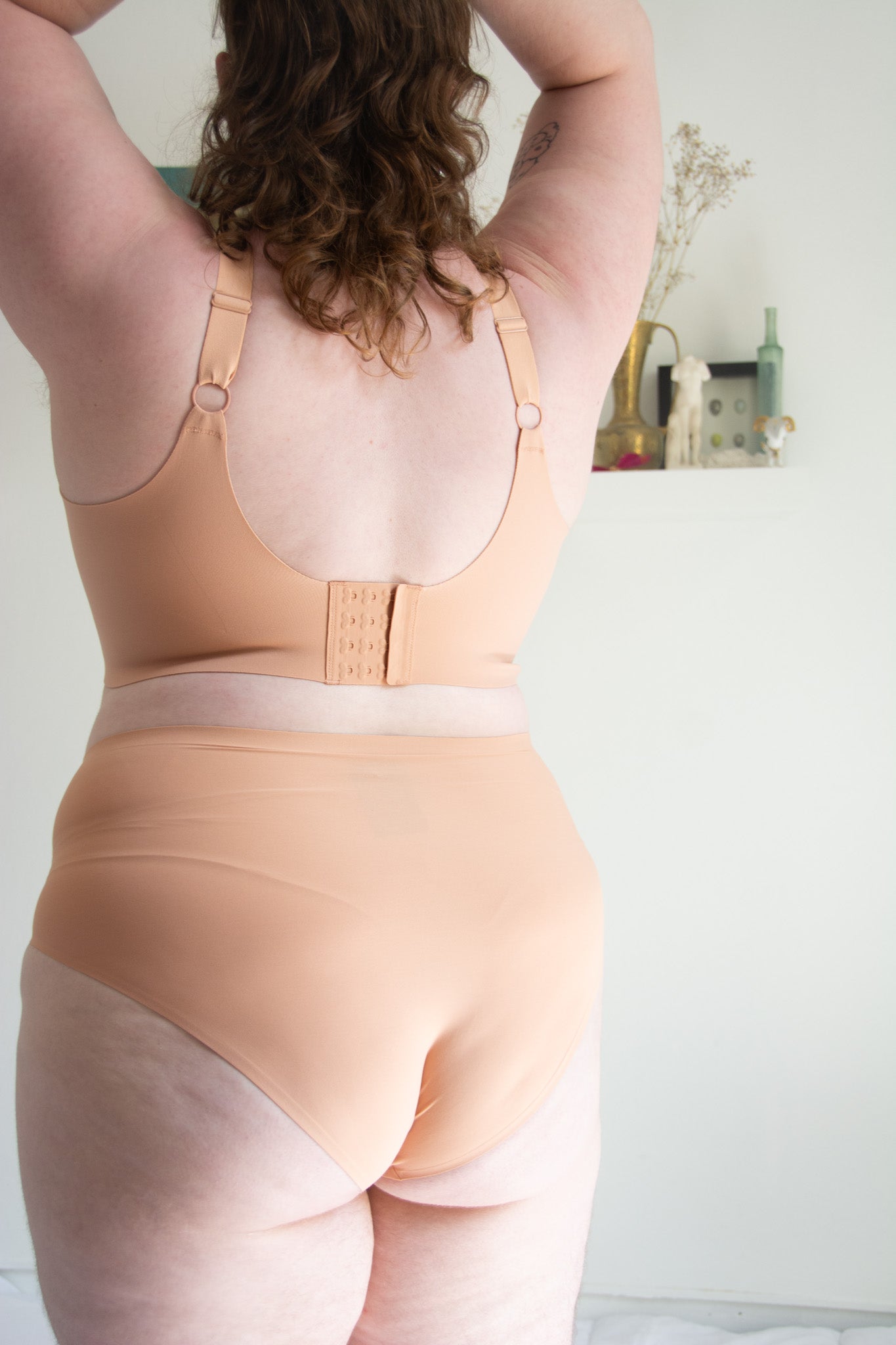 woman wearing beige bra back