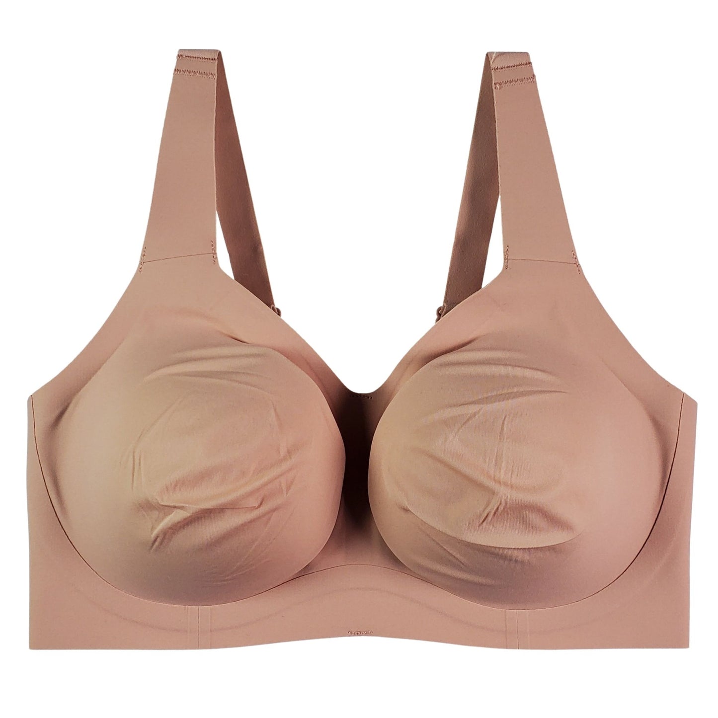 A wireless t-shirt bra with beige straps and lined cups, designed for comfort and support.