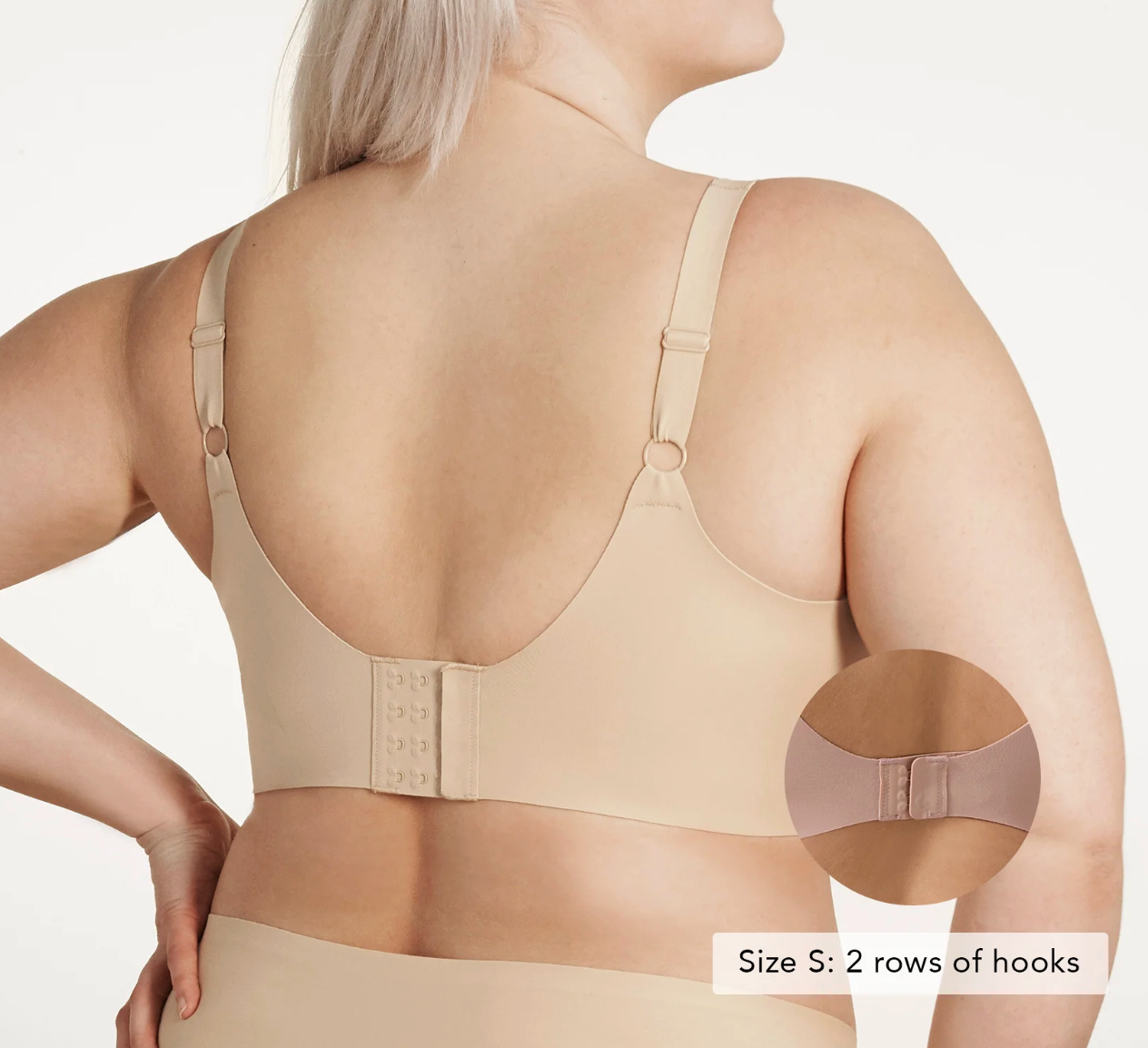 Beige compression garment worn by a person, with close-up of the back and arm area on a white background.