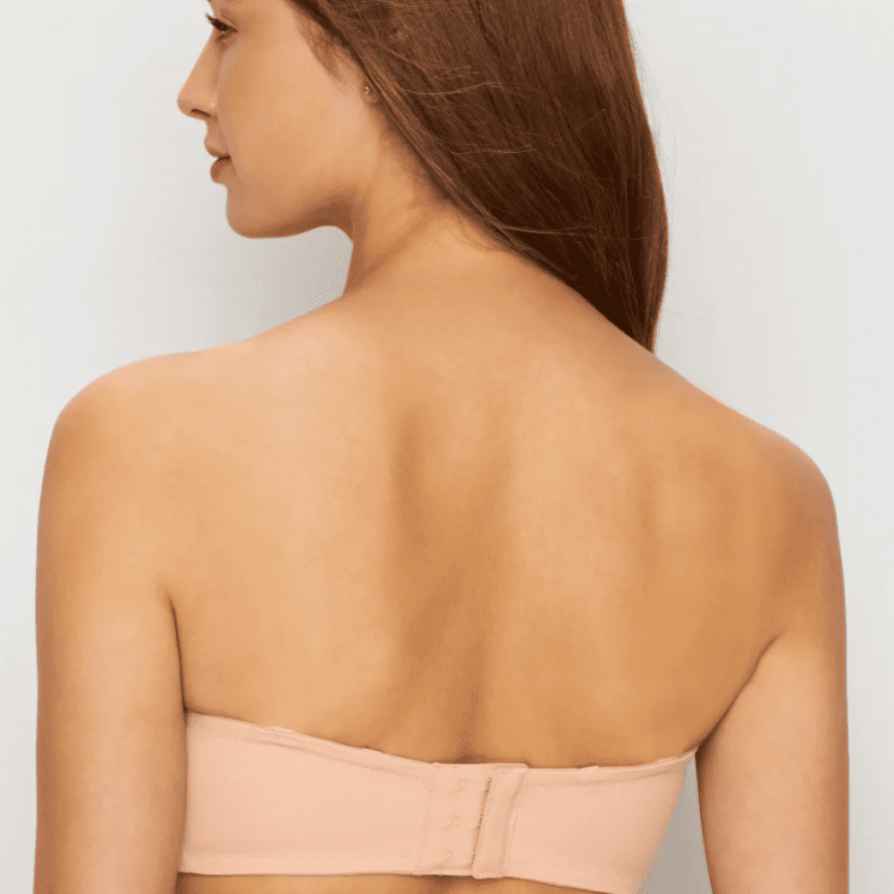 Fantasie aura strapless bra in natural beige on a model back view, close-up.