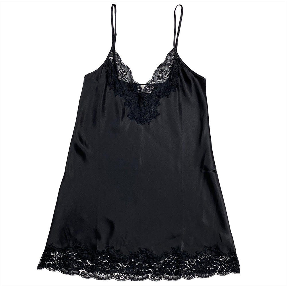A black silk chemise with lace trim at the neckline and a scoop neck.