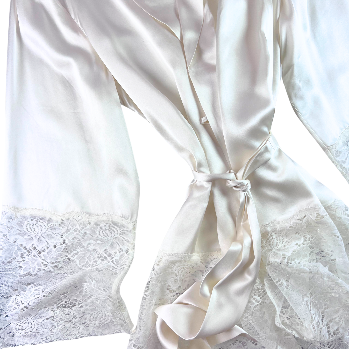 White silk robe with lace trim against a white background.