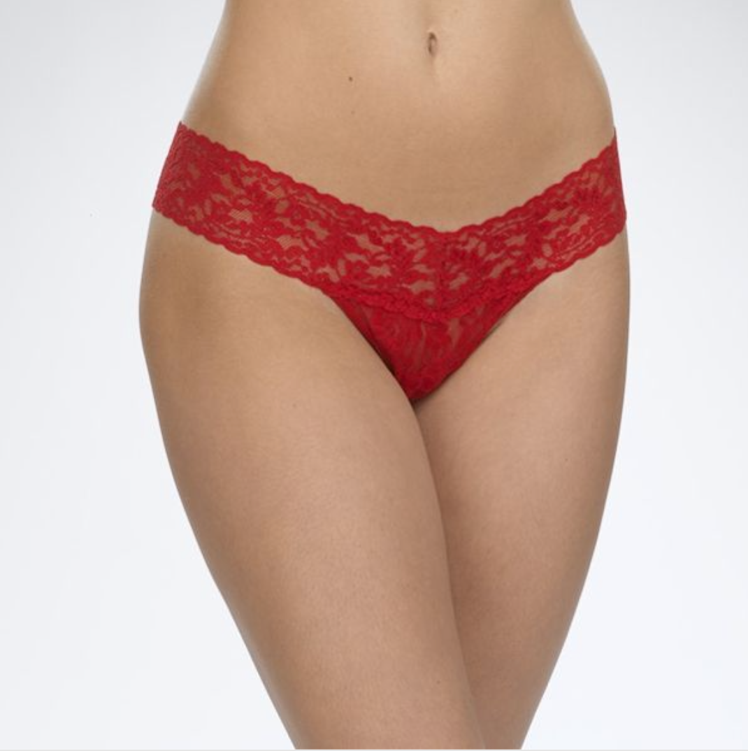 Person wearing red underwear against a white background.