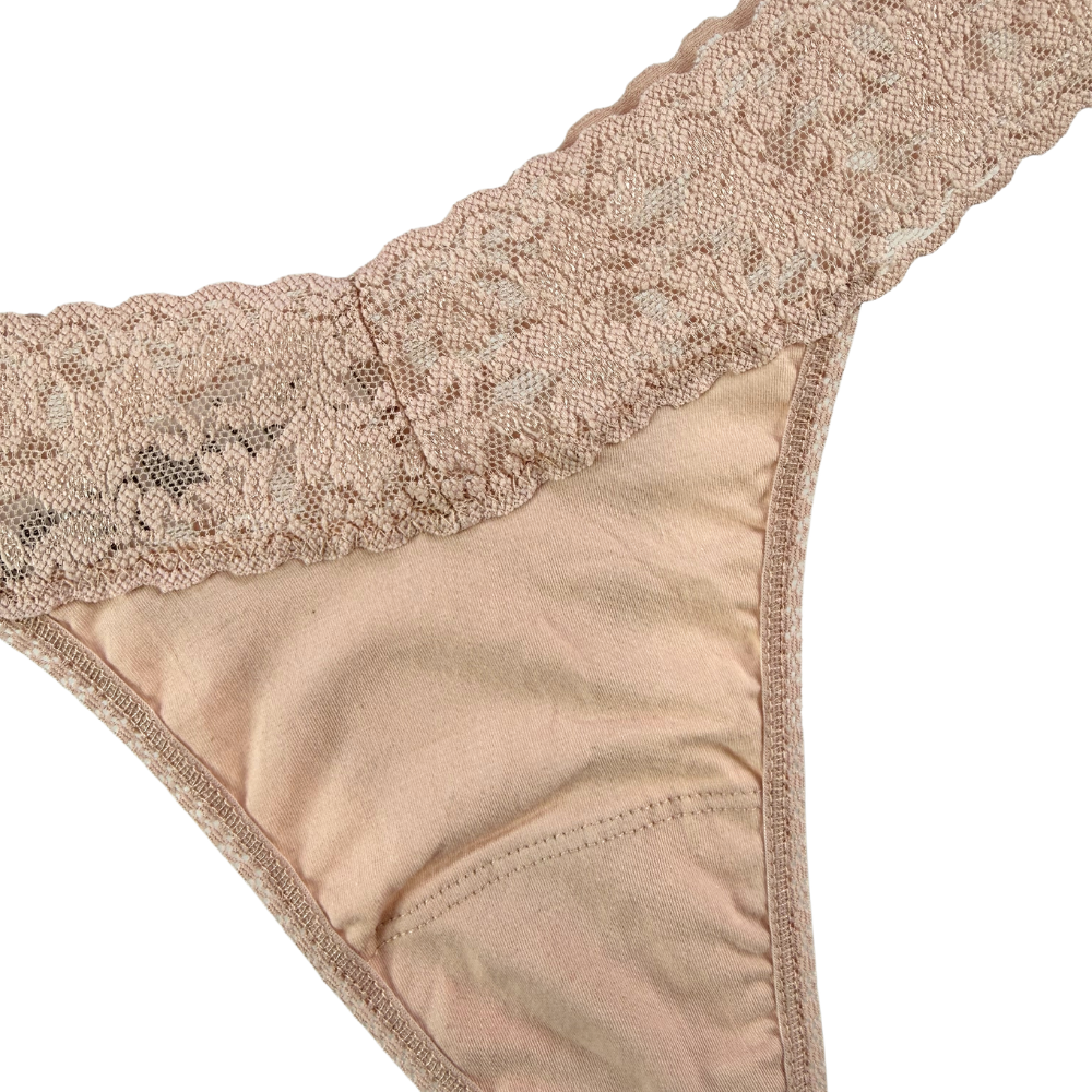 Beige lace-trimmed fabric on a white background