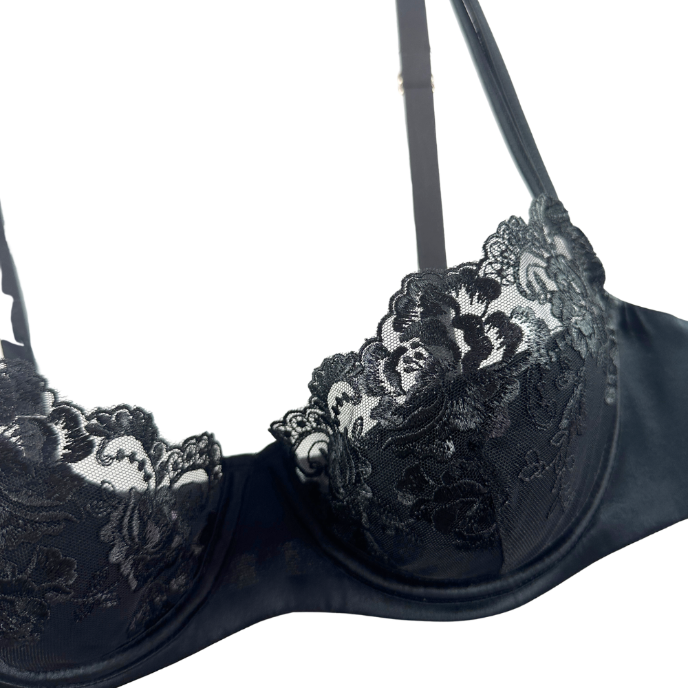 Black lace bra on a white background