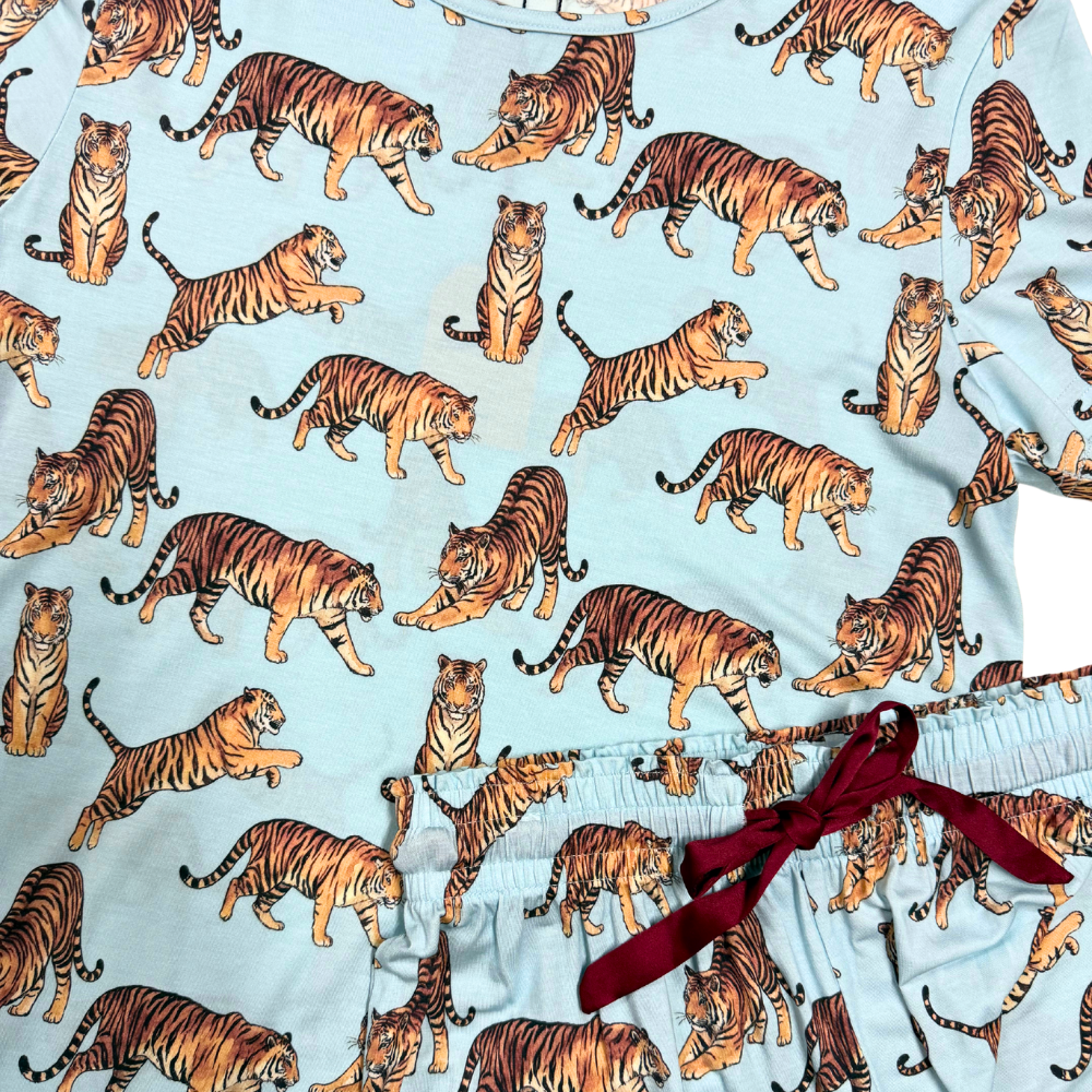 close up of tiger printed pajamas against a white background