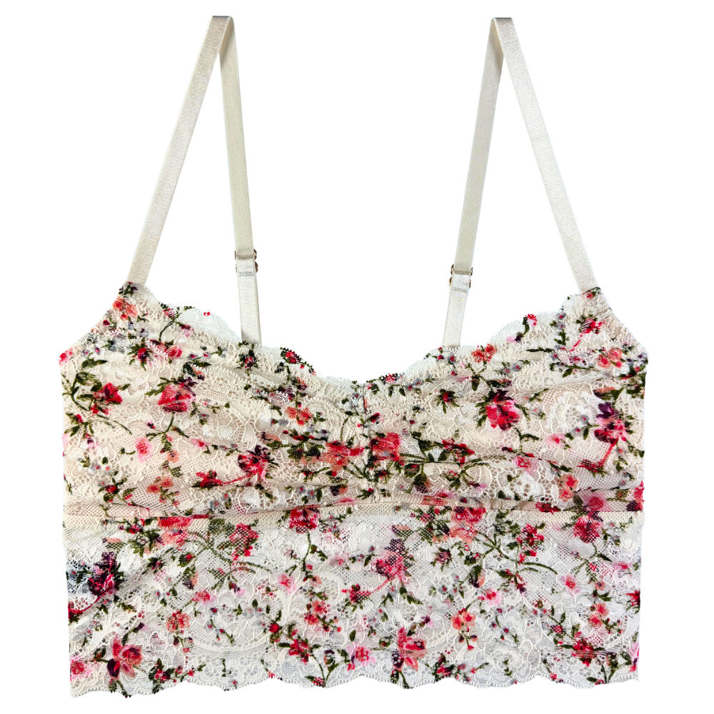 Floral patterned top with thin straps on a white background