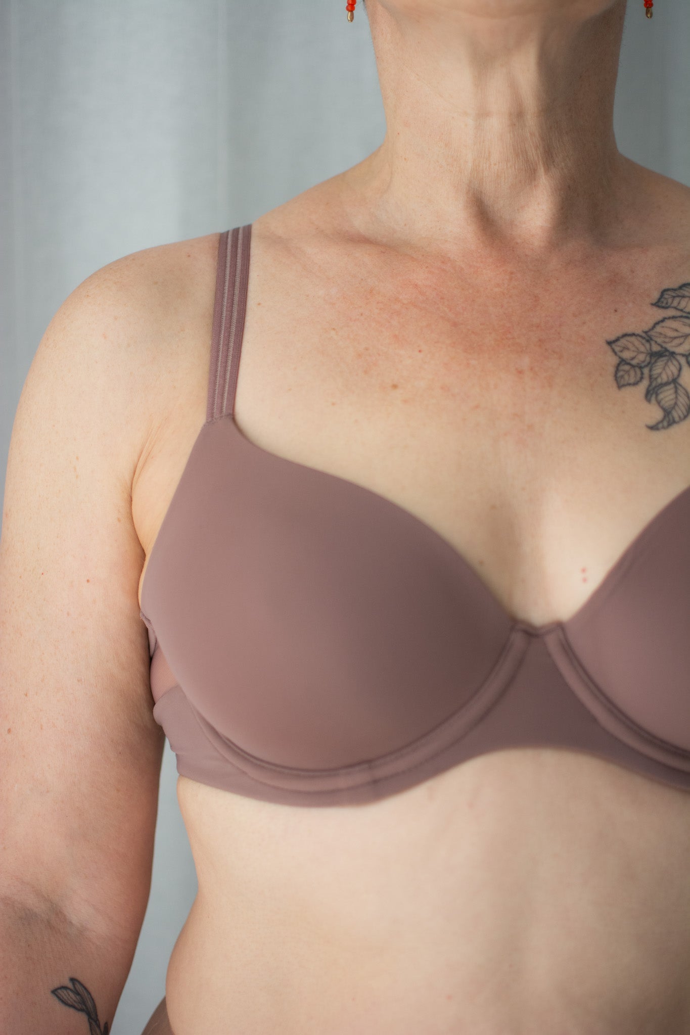 Brown bra worn by a person against a neutral background