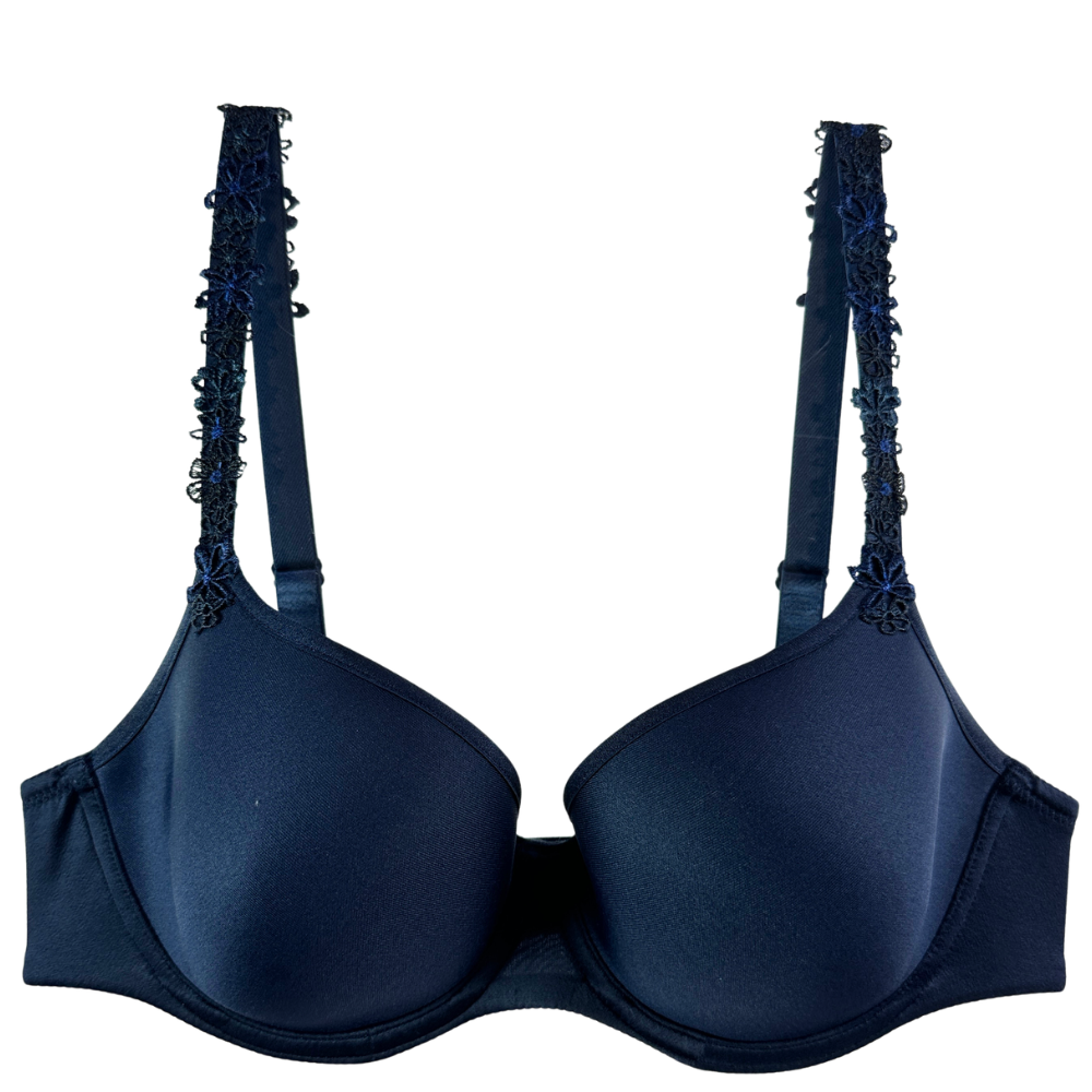 A dark navy blue wireless bra with decorative lace-up straps, shown against a plain white background.
