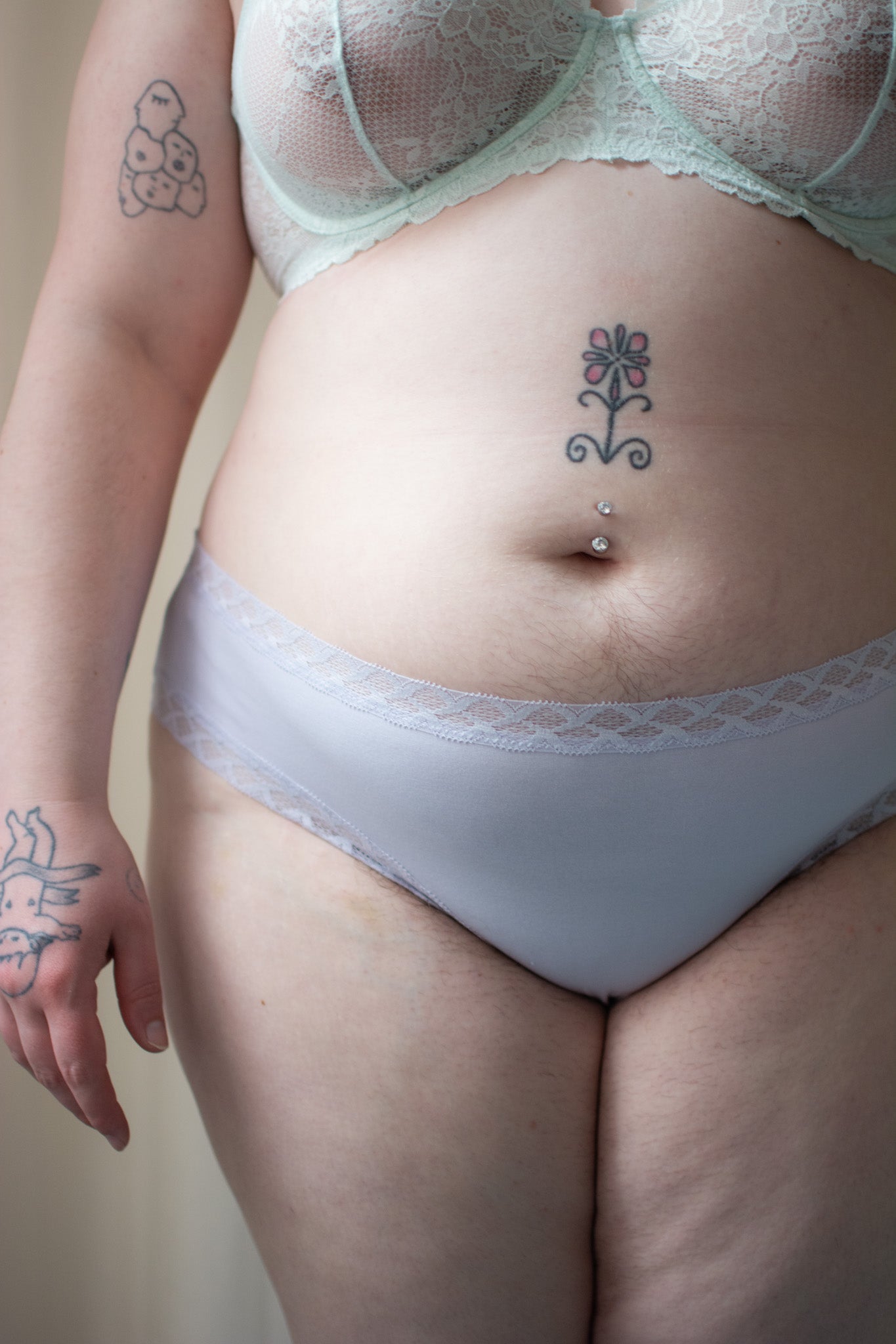 Natori Bliss girl brief in purple pearl, front view on a model, close-up.