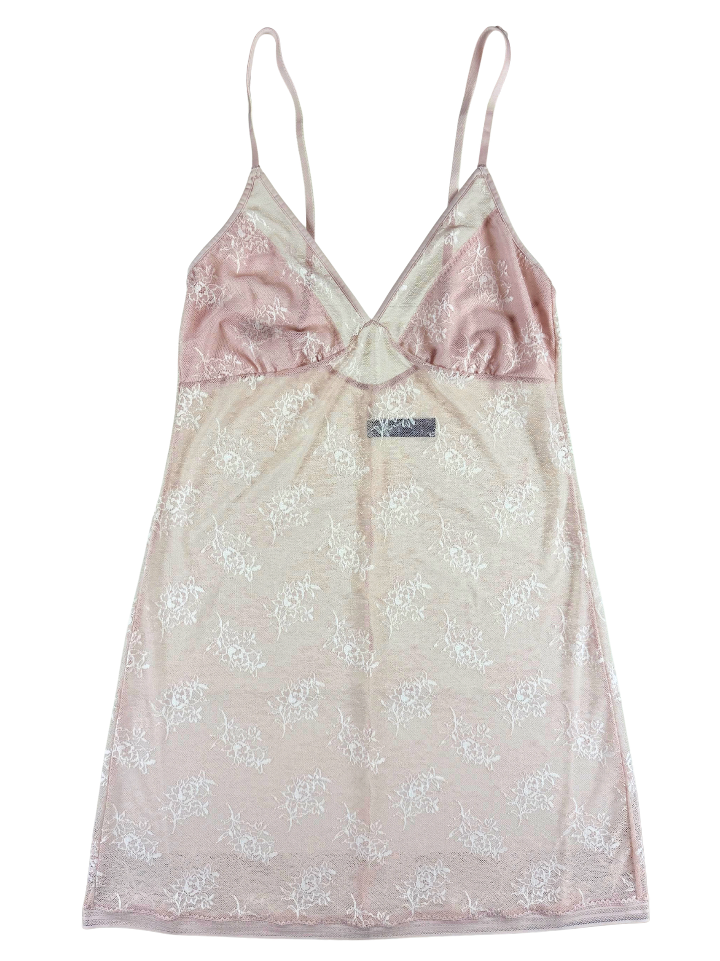 A light pink and beige camisole nightgown with a white floral pattern, featuring thin spaghetti straps and a V-neckline.