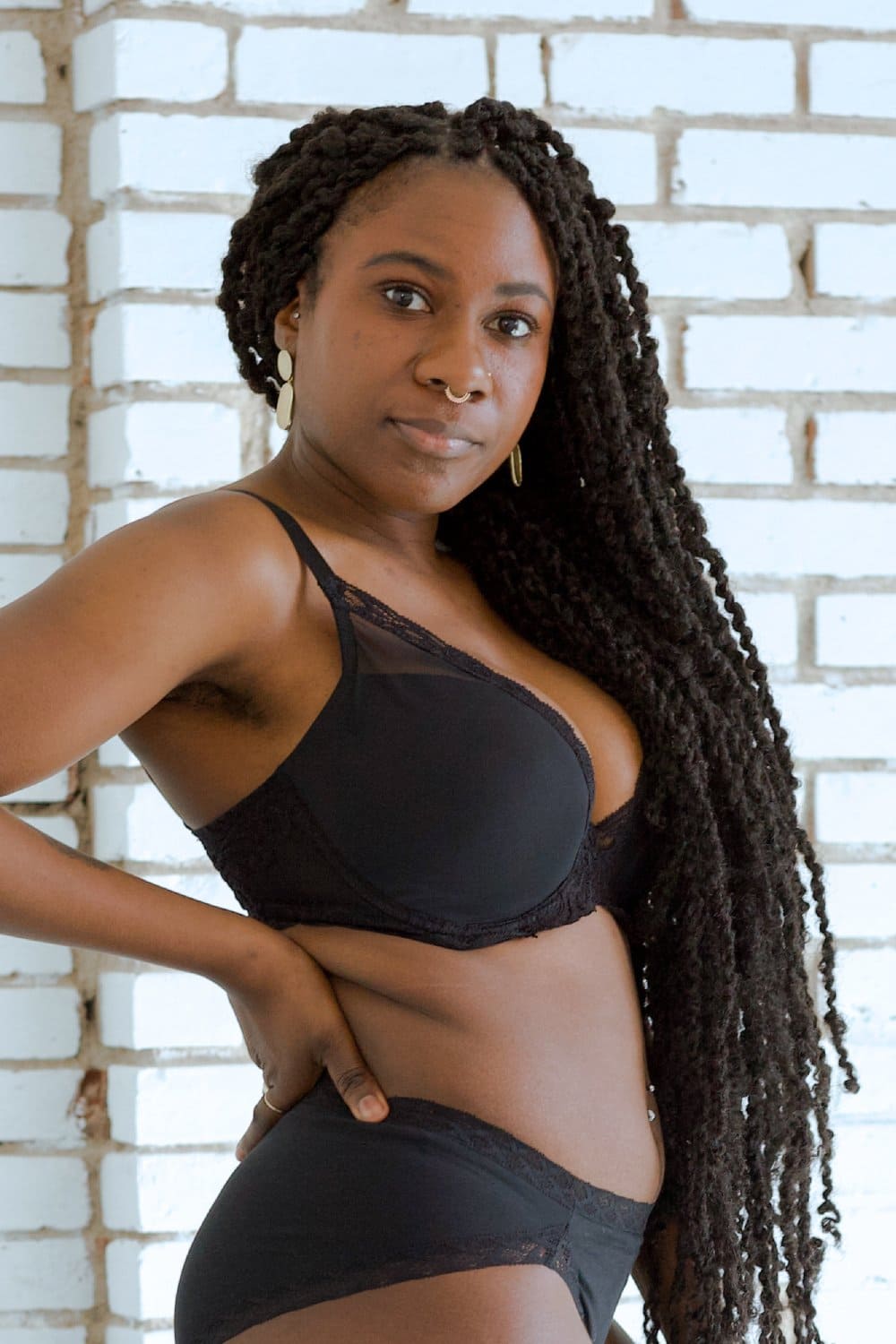 Natori Feathers contour plunge bra in black, close-up side view on a model.