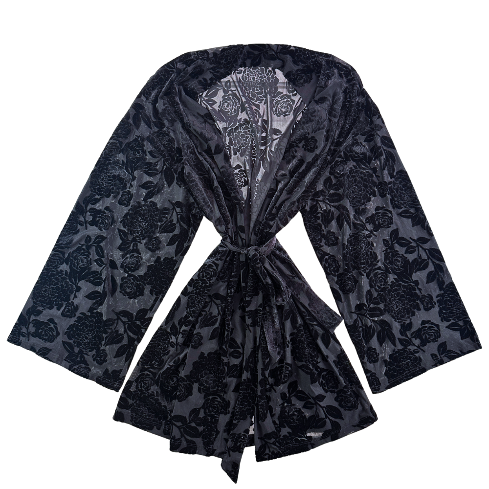 black floral robe against a white background.