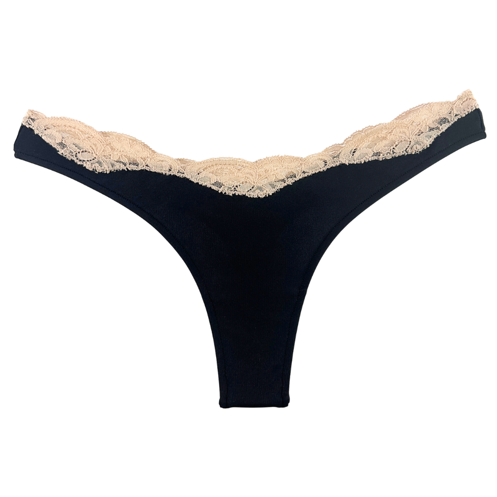 Black thong with beige lace trim on a white background