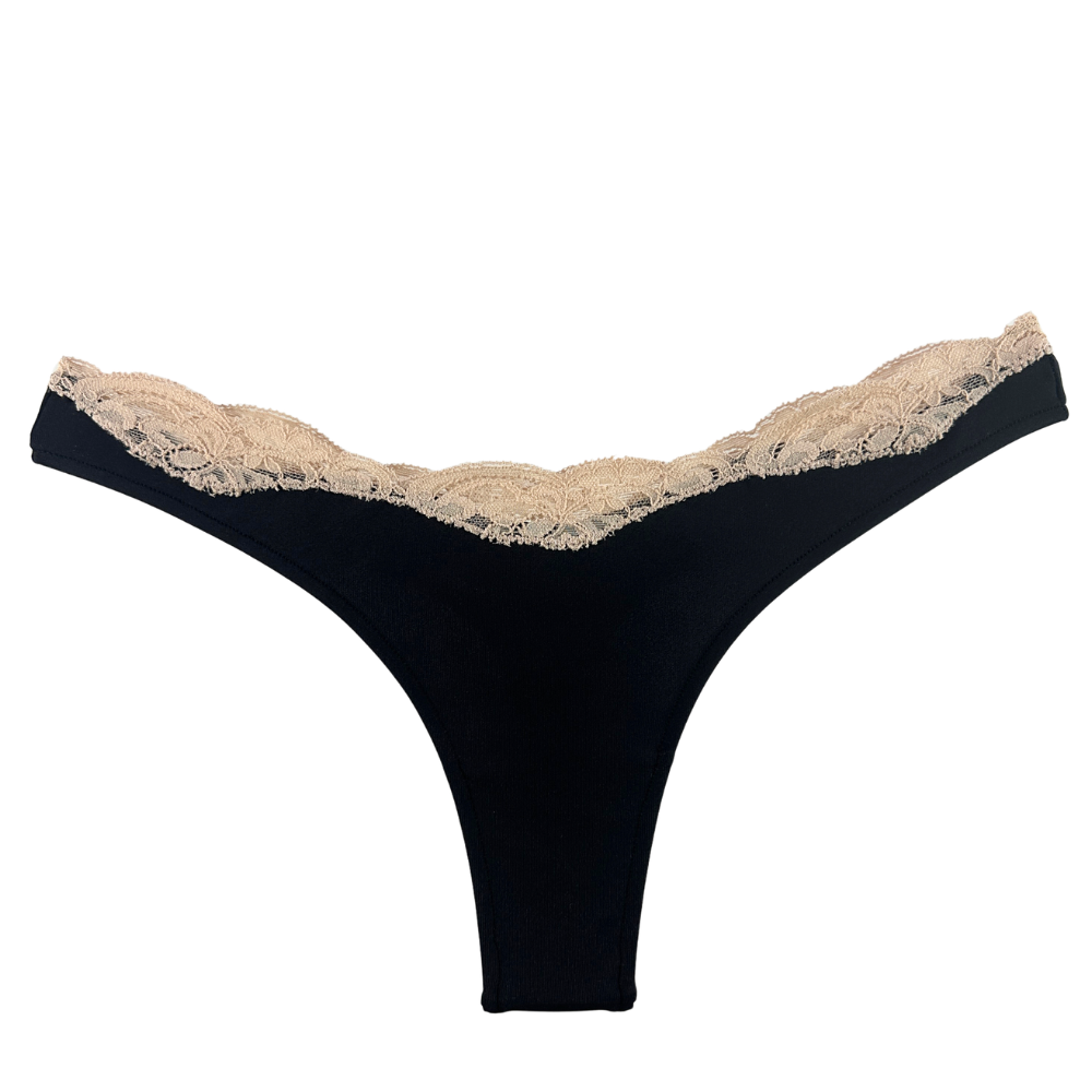 Black thong with beige lace trim on a white background