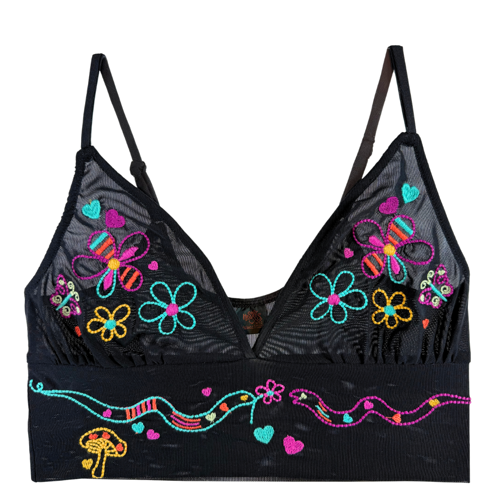 black mesh crop top with neon snake and floral embroidery against a white background.