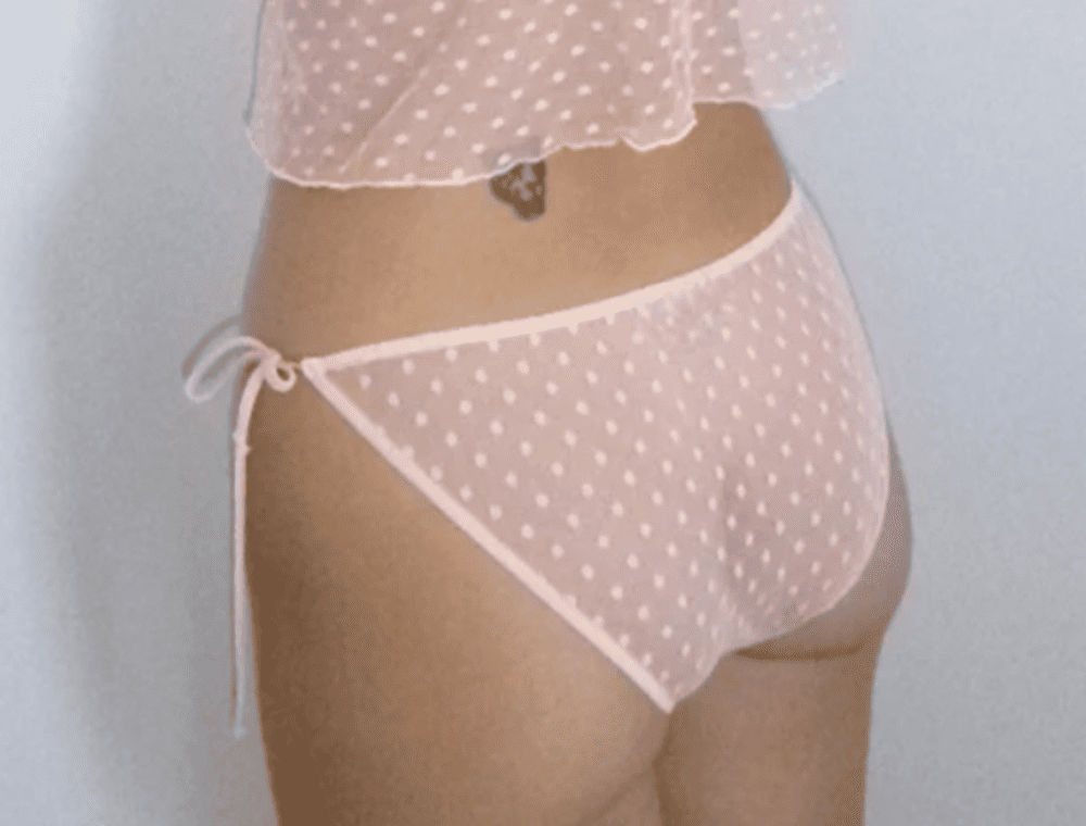 Only hearts coucou lola string bikini in petal pink, back view on a model, close-up.