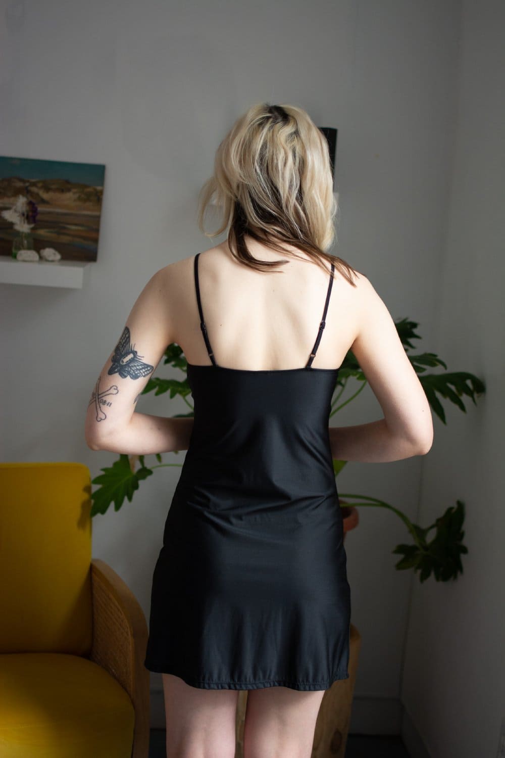Only hearts second skin short slip in black, back view on a model.