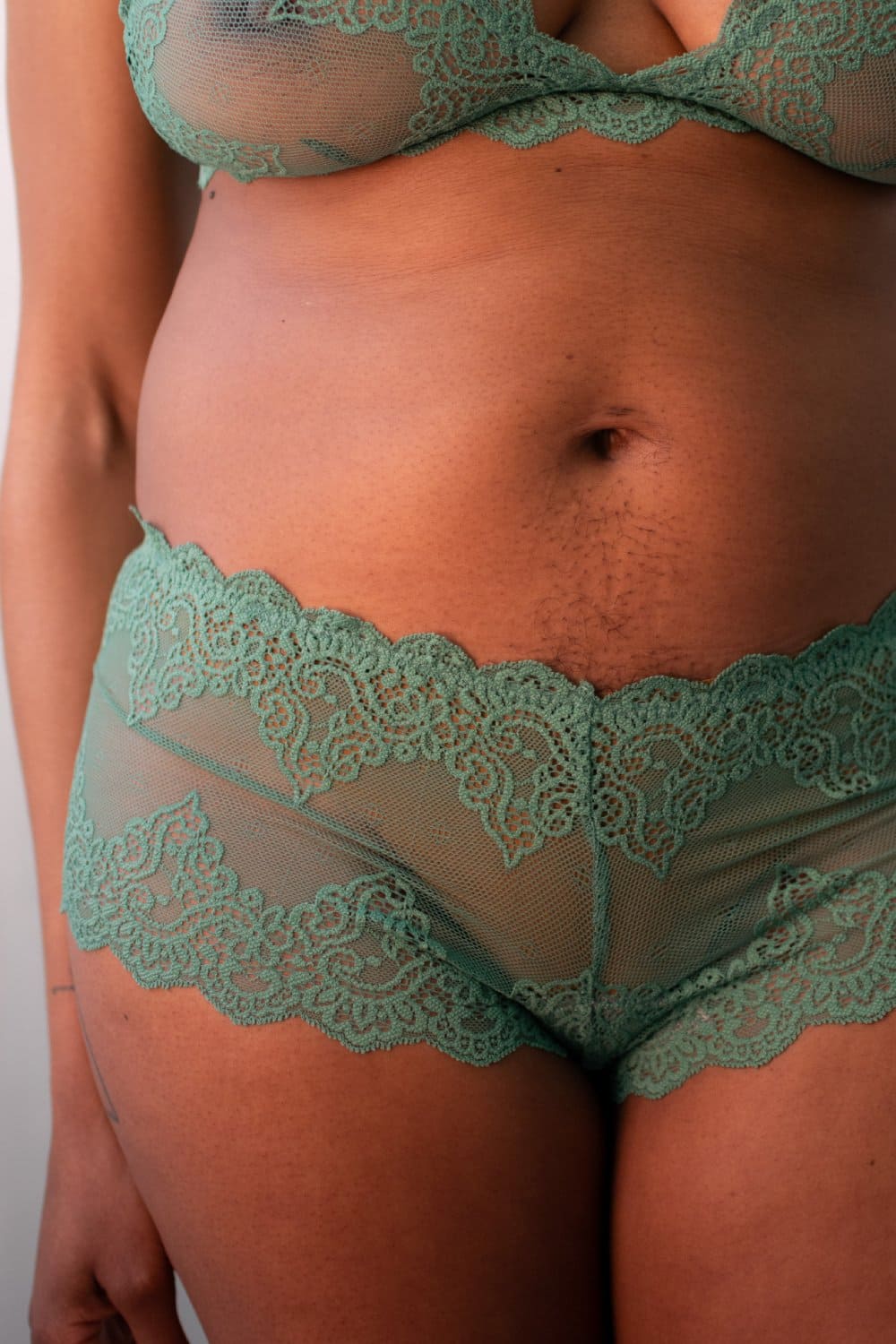 Only hearts so fine lace hipster in martini, front view on a model, close-up.