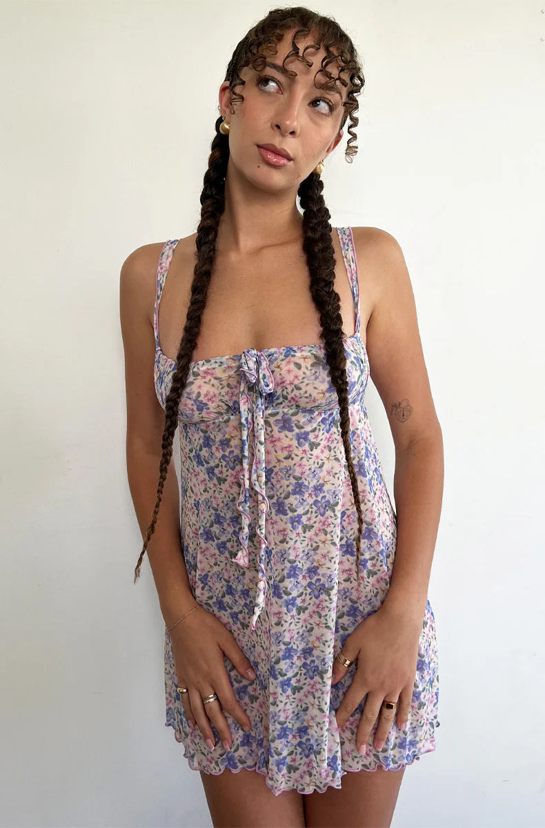 Woman wearing a colorful floral mesh slip