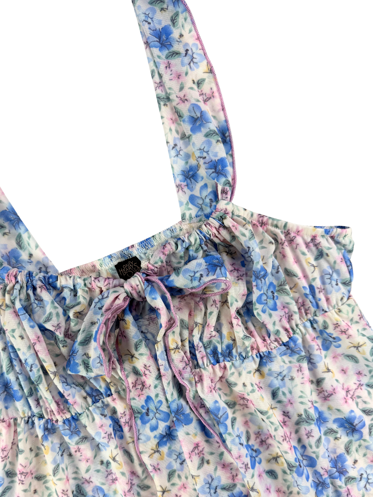 Floral patterned dress with straps on a white background