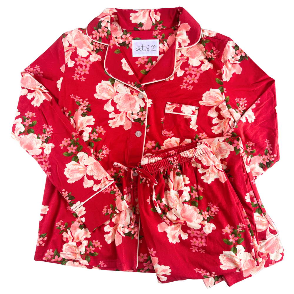 red floral long pajamas against a white background.