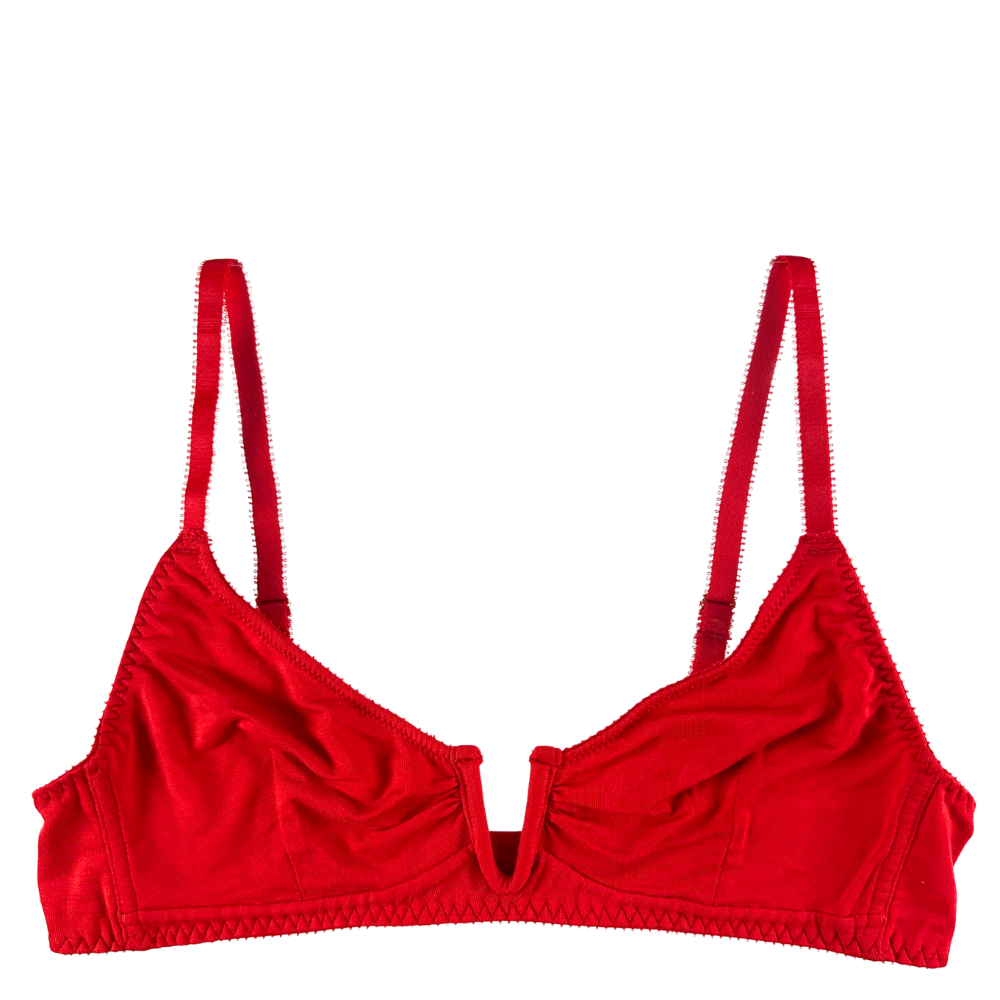 A bright red bralette with a gathered, ruched center front and thin adjustable shoulder straps, shown against a plain white background.