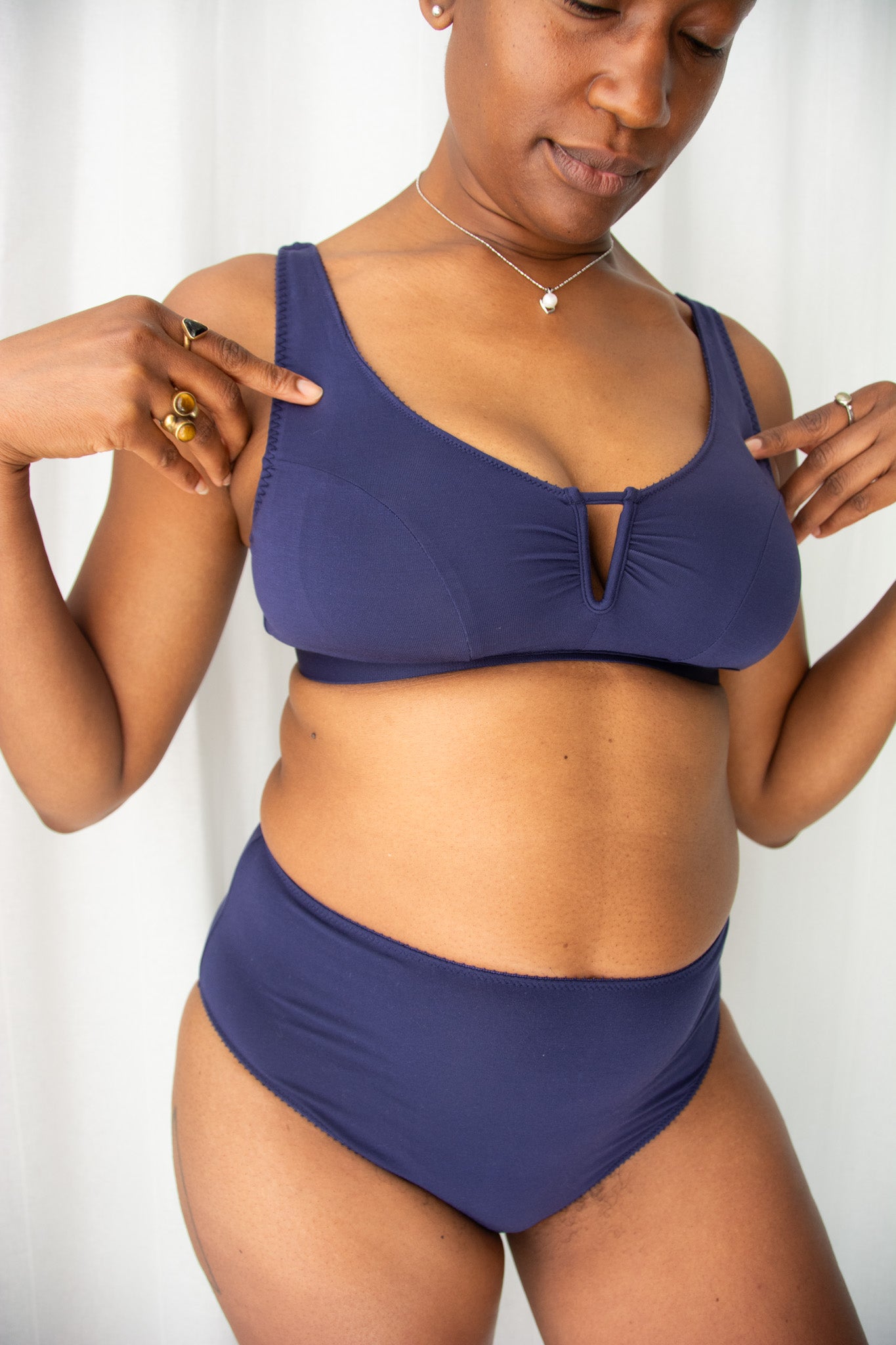 Woman wearing a blue bikini against a white background