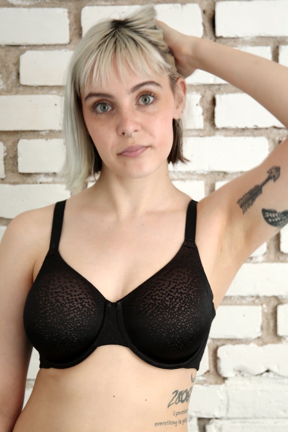 Wacoal Back Appeal full cup bra in black, front close-up on a model against a brick wall.