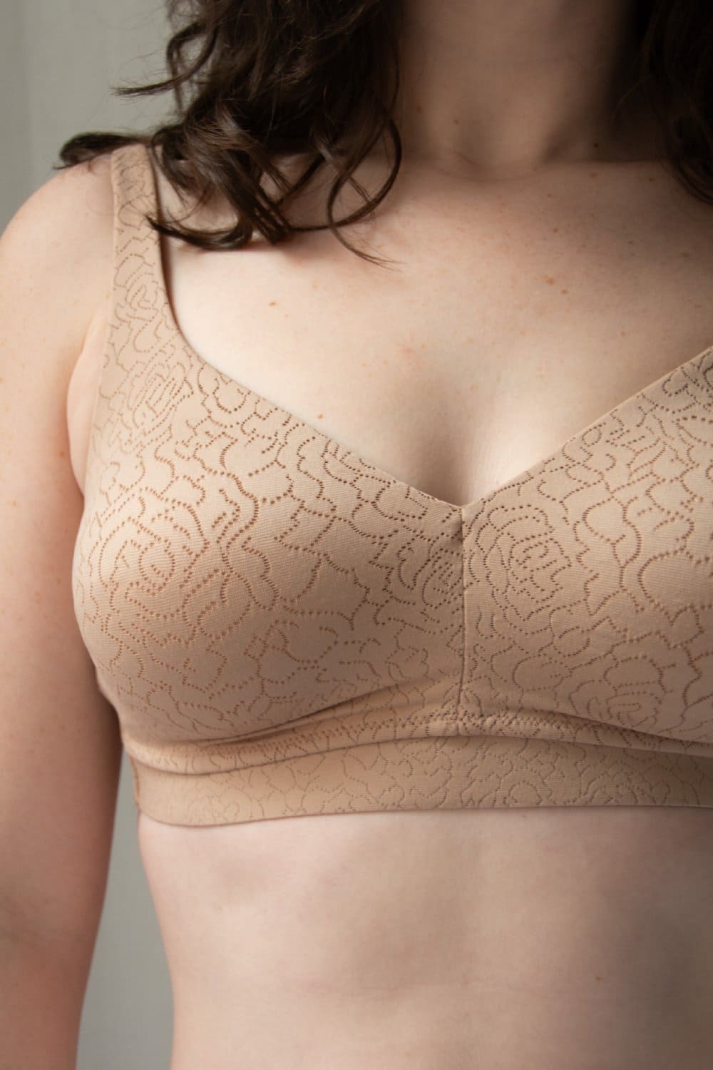 Wacoal inside job wire-free bra in roebuck, front close-up on a model.