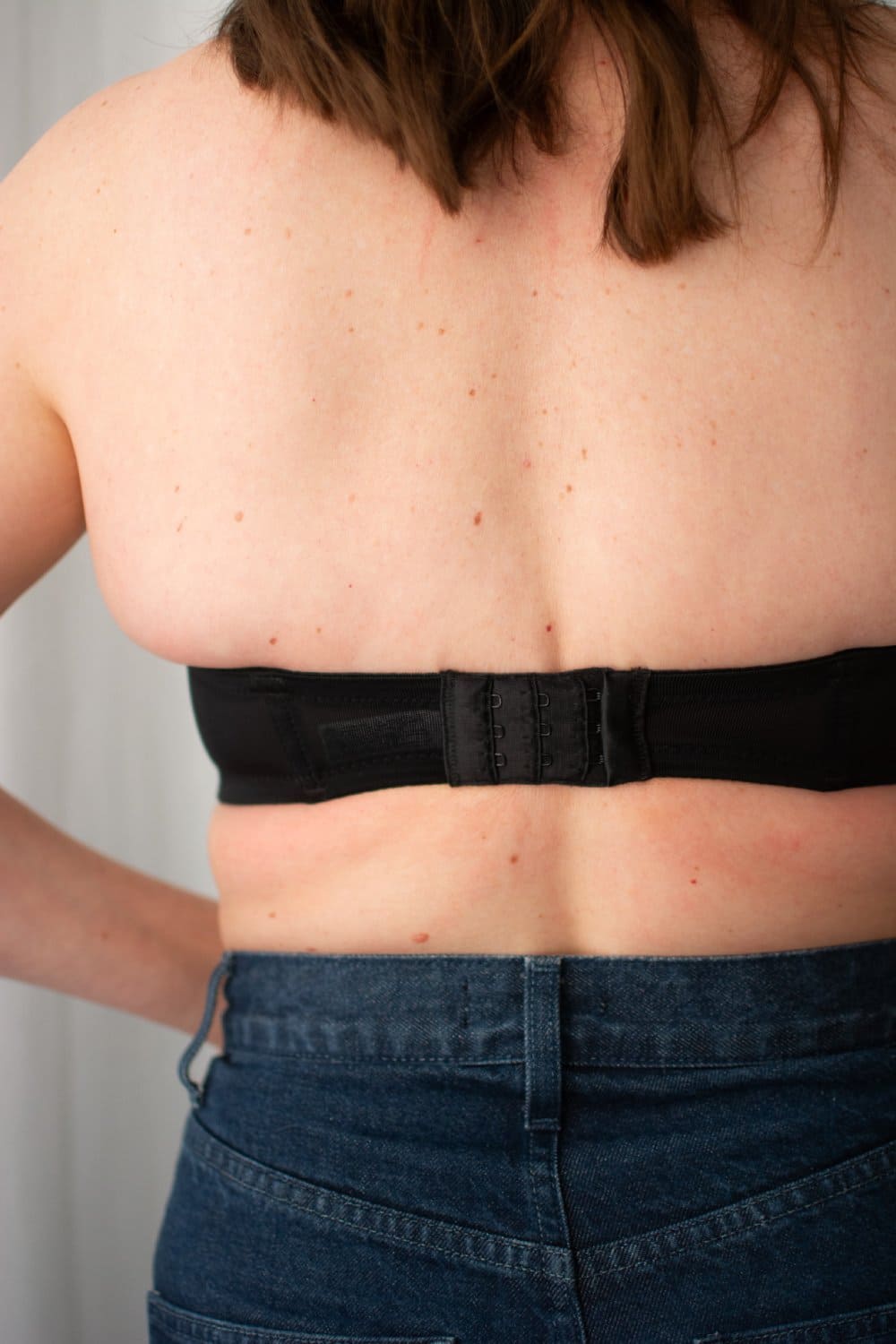Wacoal red carpet strapless bra in black, back close-up on a model.