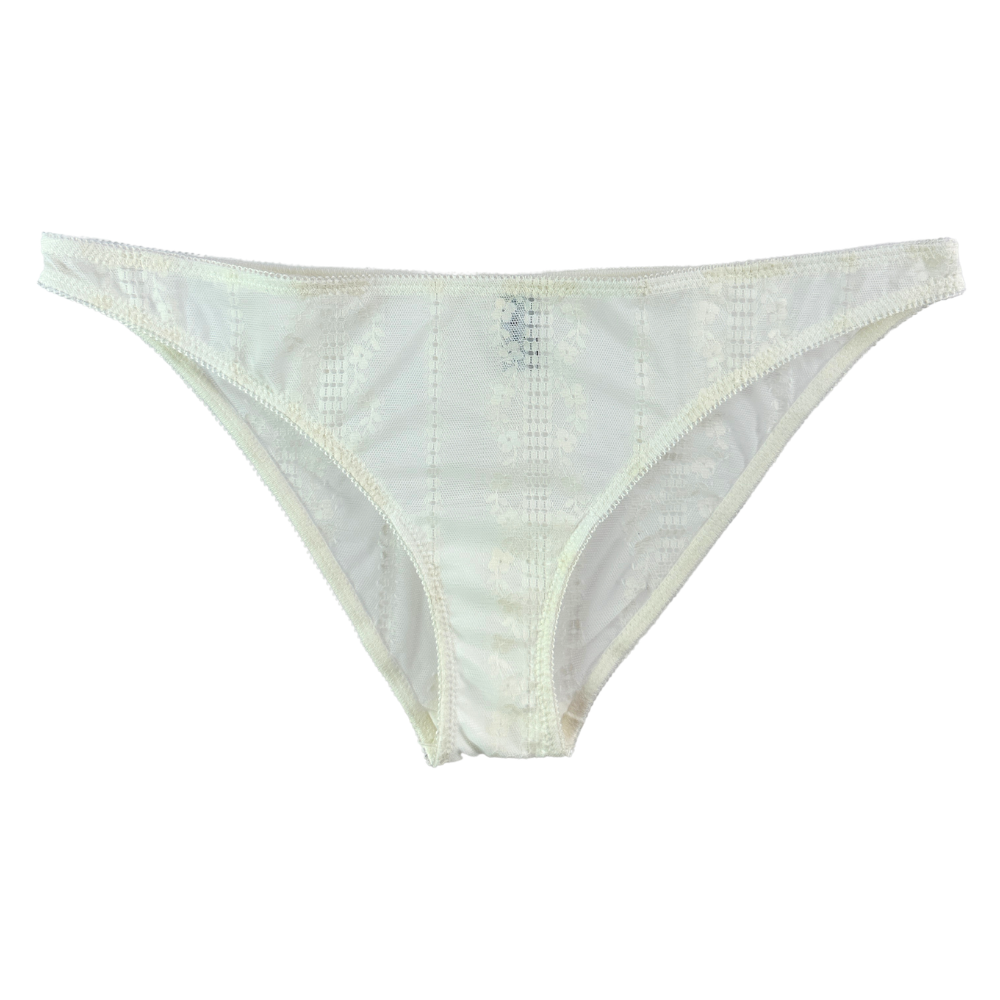 White lace bikini bottom with a sheer floral lace pattern and matching elastic trim, shown flat against a white background.