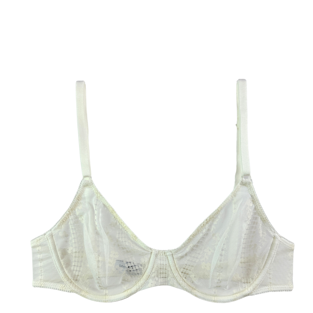 An off-white/cream wireless underwire bra with a sheer mesh and lace panel design, featuring thin adjustable shoulder straps and a center gore, shown against a plain white background.