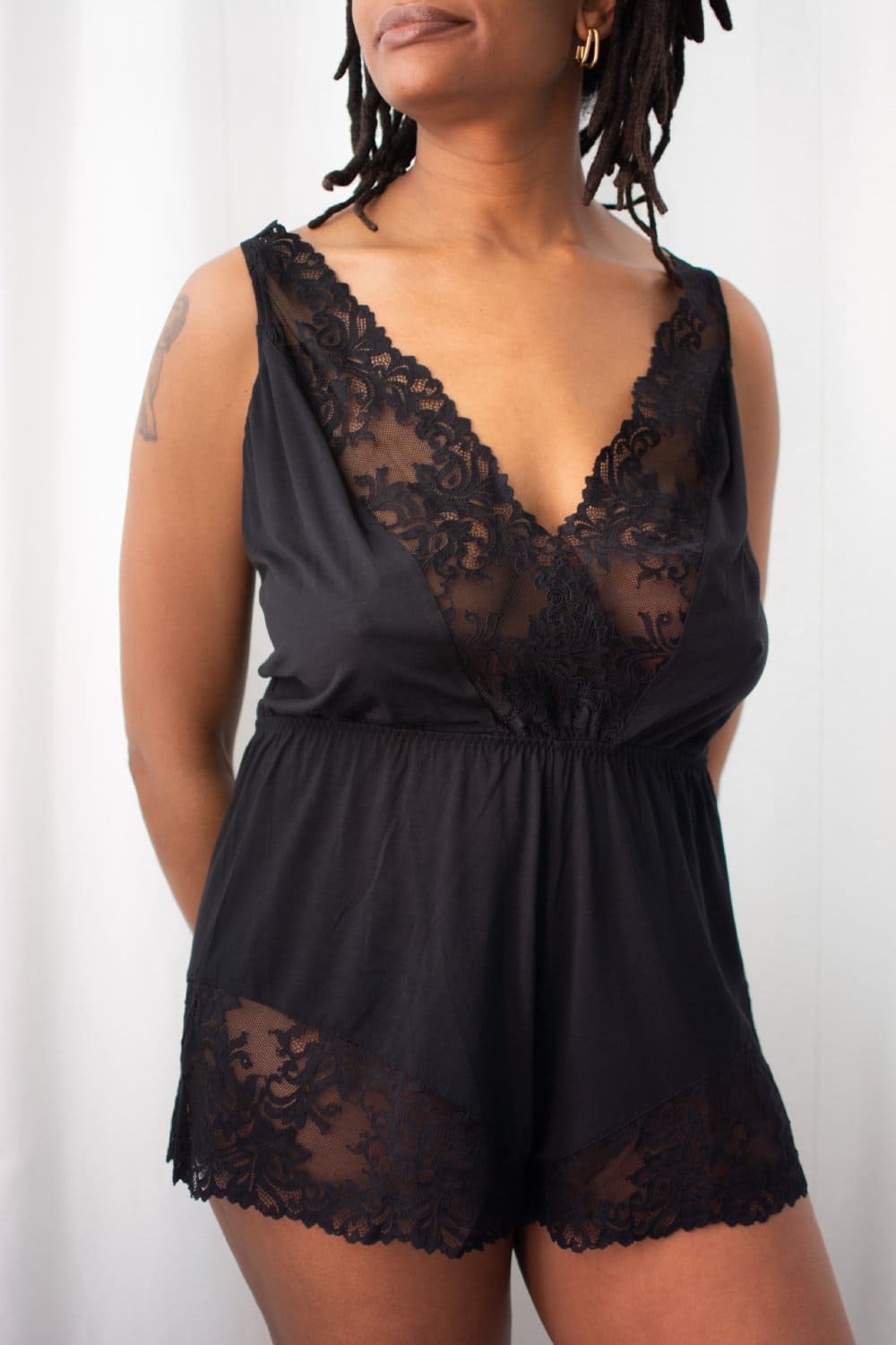 Cosabella carmela sleep romper in black, a model front view.