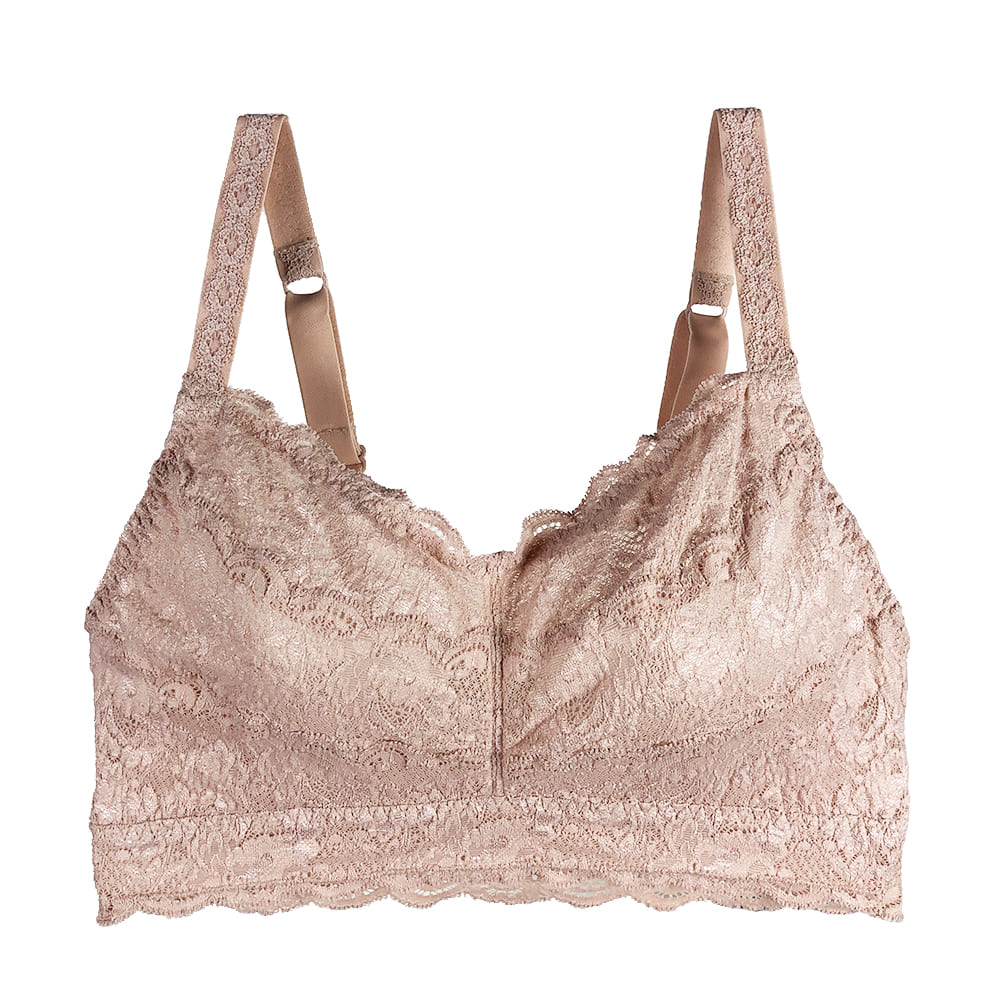 Beige lace bra against white background