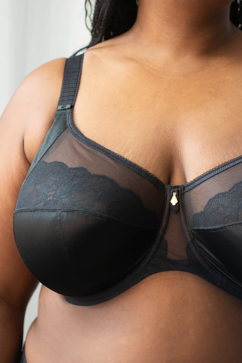 Elomi cate allure underwire bra in black, front view on a model, close-up.