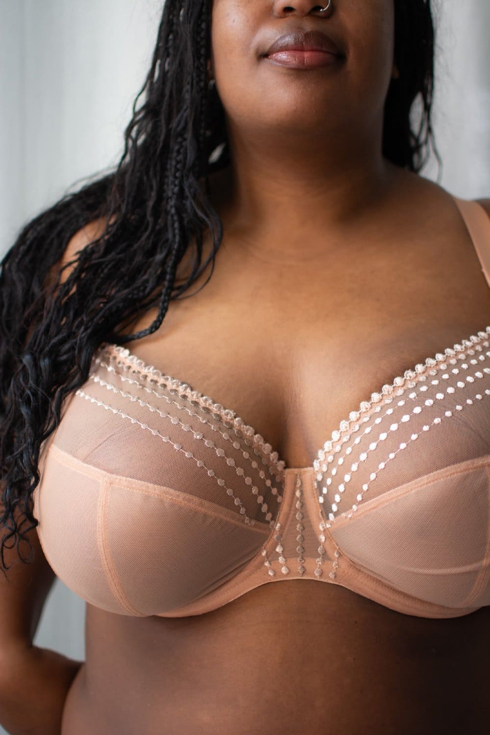 Elomi matilda plunge bra in cafe au lait, front view on a model, close-up.