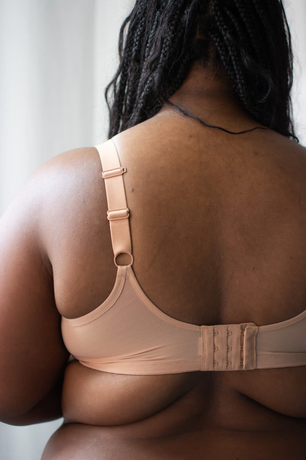 Elomi matilda plunge bra in cafe au lait, back view on a model, close-up.